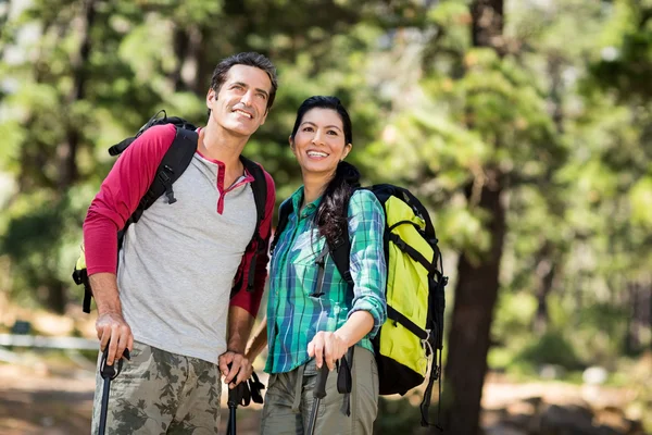 Couple smiling and hiking