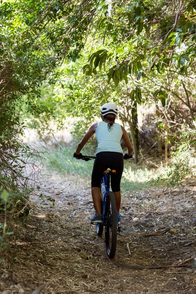 Woman front the back riding bike