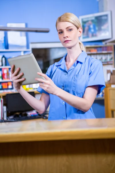 Portrait of woman vet working with her tablet computer