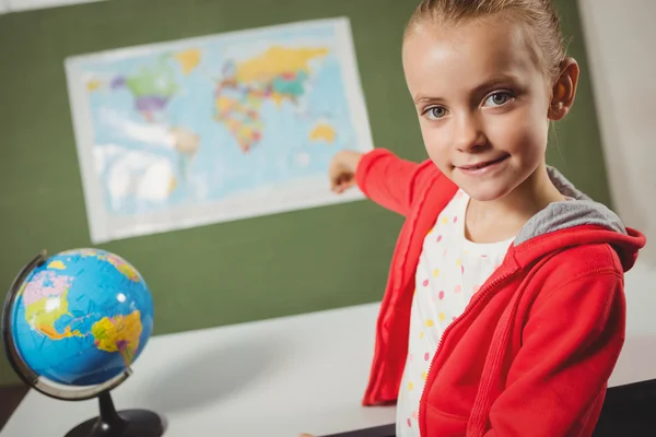 Girl pointing on world map