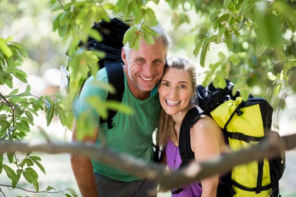 Couple smiling and posing during a hike