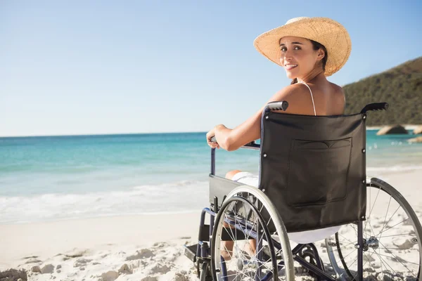 Wheelchair woman sitting smiling at camera