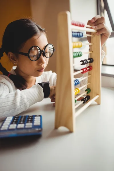 Schoolchild using a slide rule