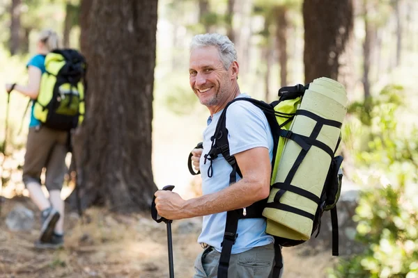 Man smiling and hiking