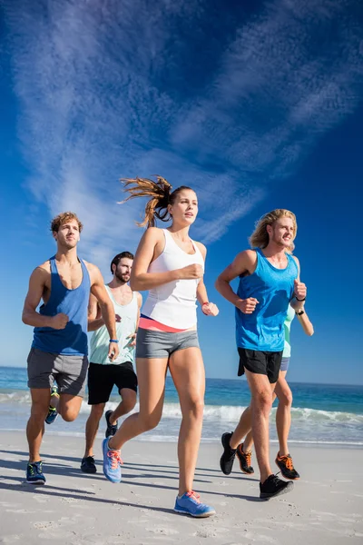 People jogging on the beach