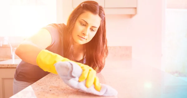 Concentrated woman scrubbing bar