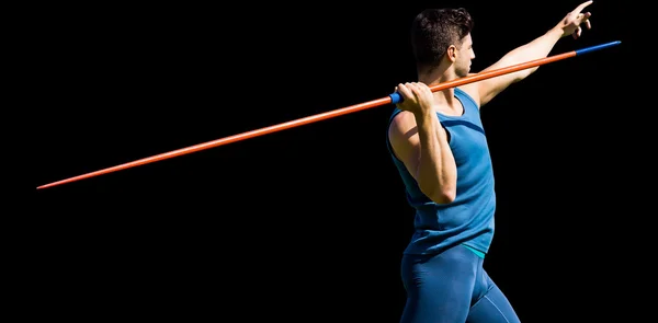 Sportsman practicing javelin throw