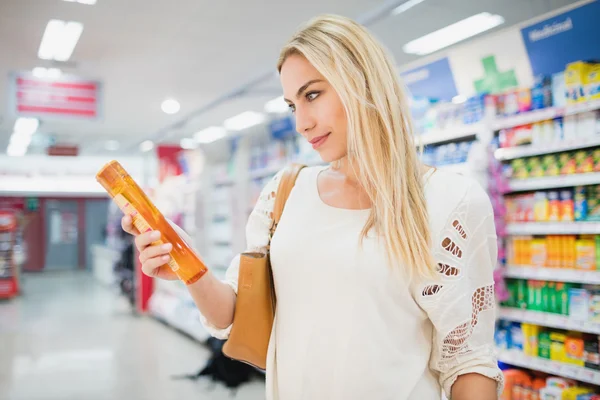 Woman holding a shampoo