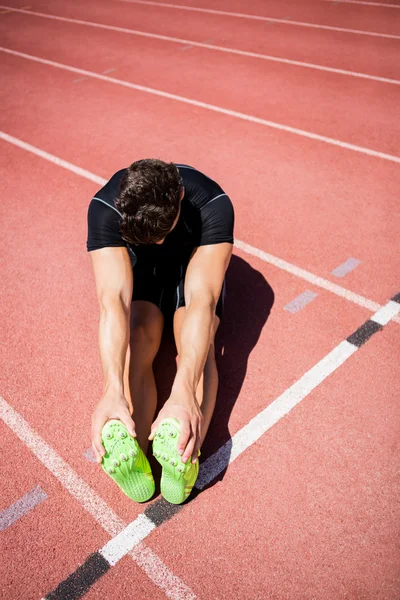 Tired athlete on running track