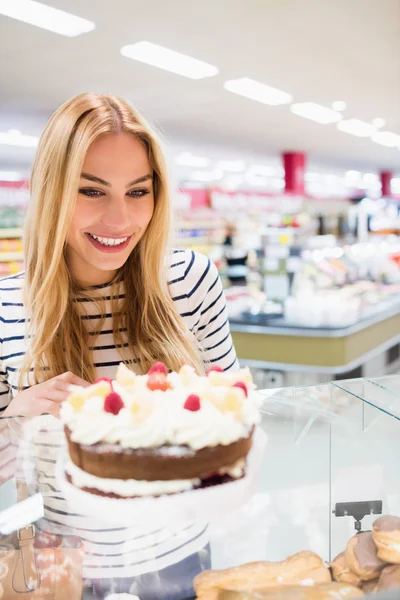 Woman looking at cake