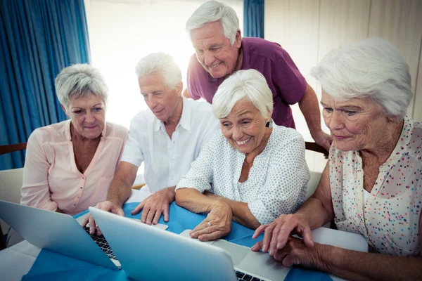 Group of seniors using a computer