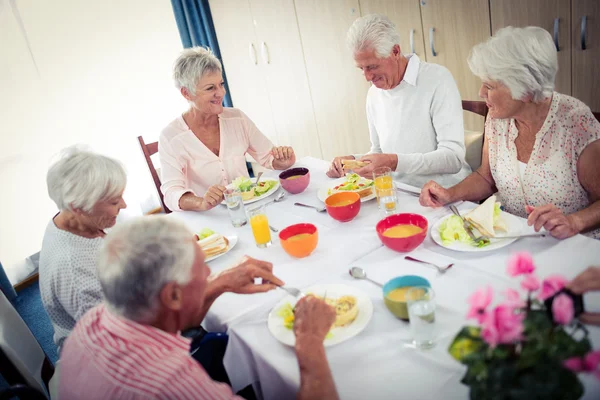 Pensioners at lunch in retirement house