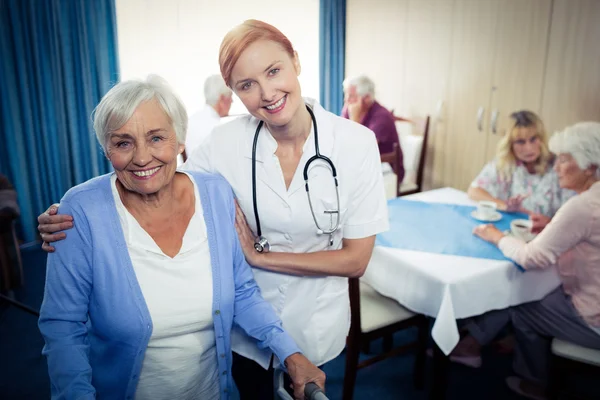 Nurse assisting senior