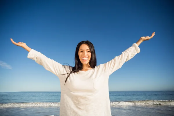 Woman standing with arms outstretched