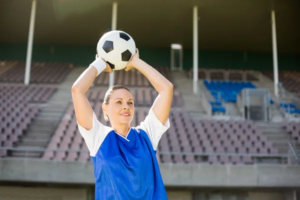 Football player about to throw football