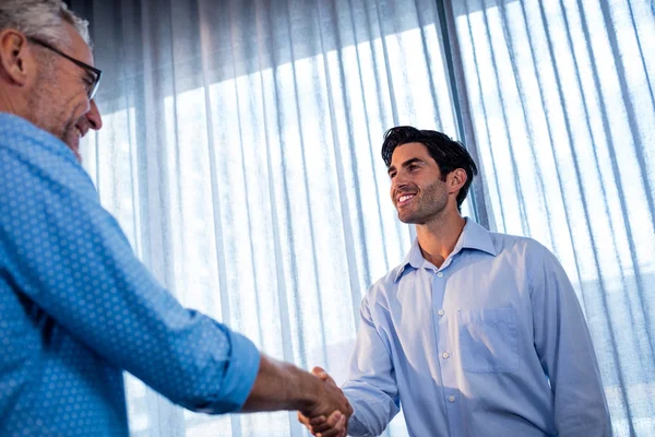 Two businessmen giving a handshake