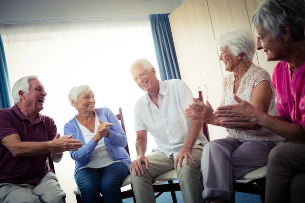 Seniors interacting in retirement house