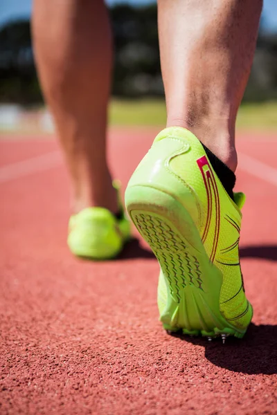 Athletes feet running on racing track