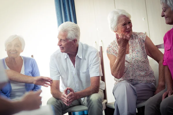 Seniors interacting in retirement house