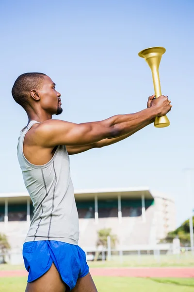 Athlete holding fire torch