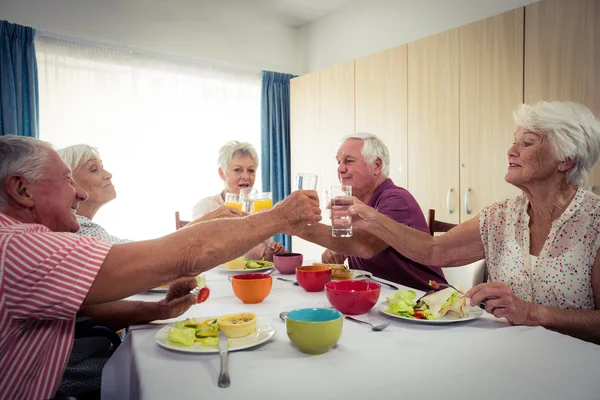 Pensioners at lunch in retirement house