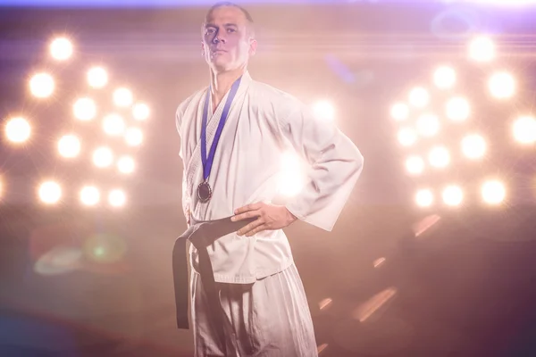 Fighter posing with medal