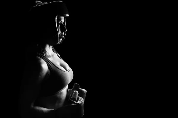 Female boxer with headgear and gloves