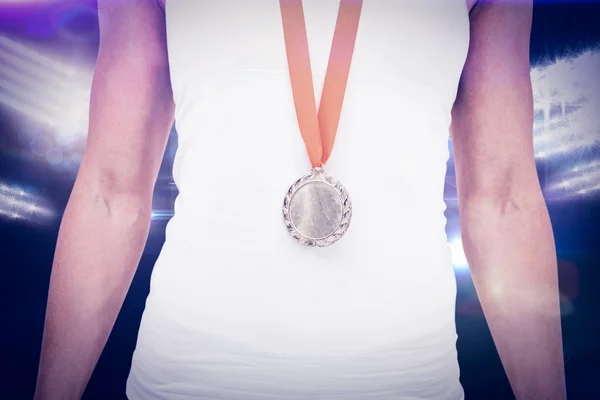 Female athlete wearing a medal