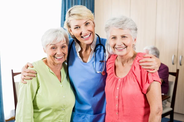 Nurse and senior women standing