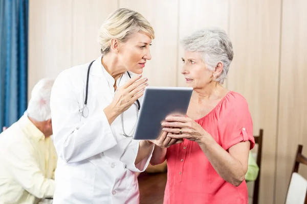 Nurse talking to a senior woman