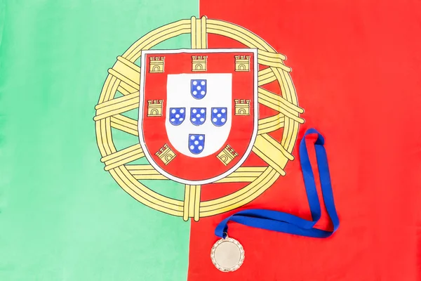 Gold medal on portuguese flag