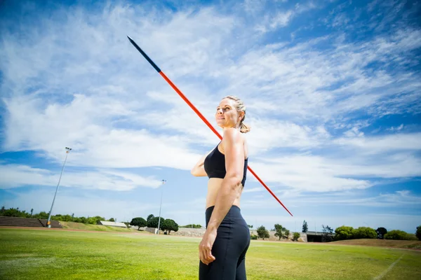 Female athlete about to throw a javelin