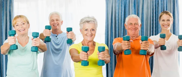 Seniors exercising with weights