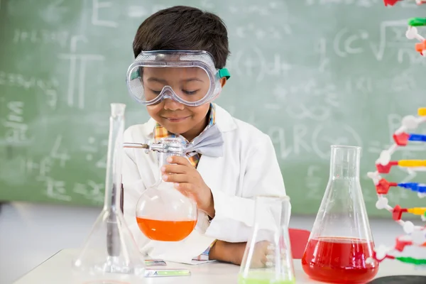 Schoolboy doing a chemical experiment