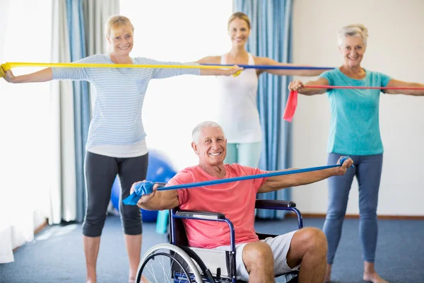 Instructor and seniors exercising