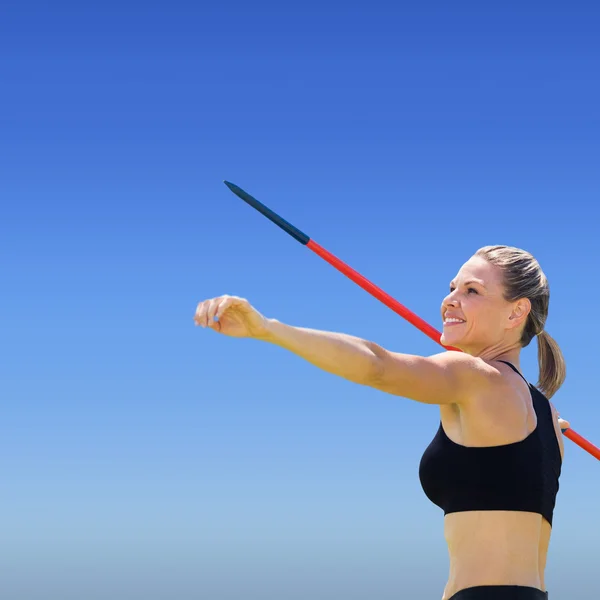 Sportswoman practising javelin throw