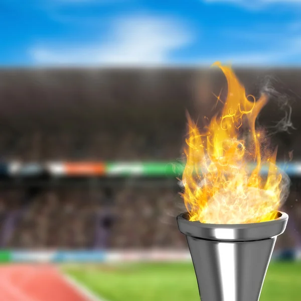 Olympic fire against view of stadium