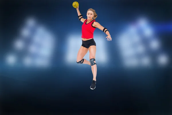 Athlete with elbow pads throwing handball