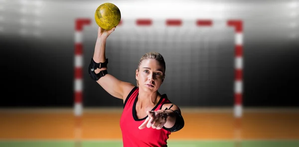 Athlete with elbow pads throwing handball