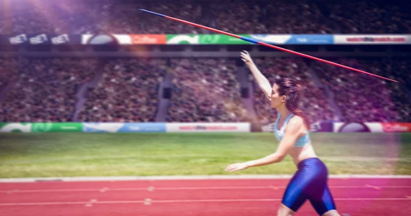 Sportswoman practising javelin throw