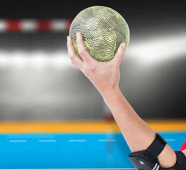 Athlete with elbow pad holding handbal