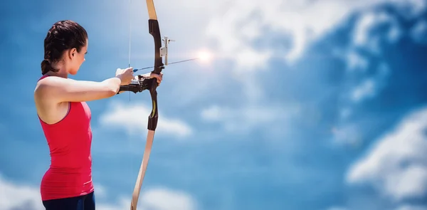 Woman practicing archery