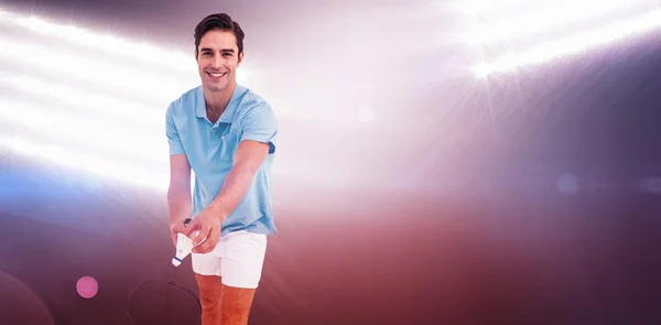 Badminton player holding racquet