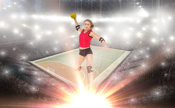 Athlete with elbow pads throwing handball