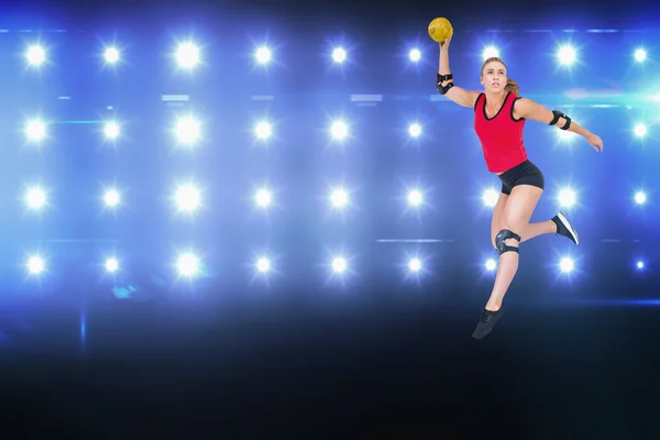 Athlete with elbow pads throwing handball