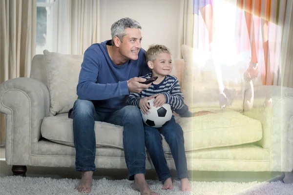 Father and son watching sport match