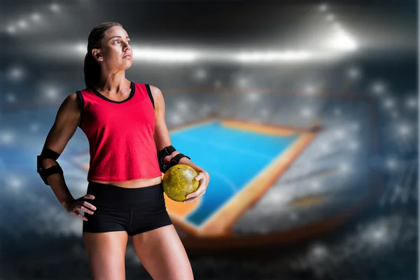 Athlete with elbow pads holding handball