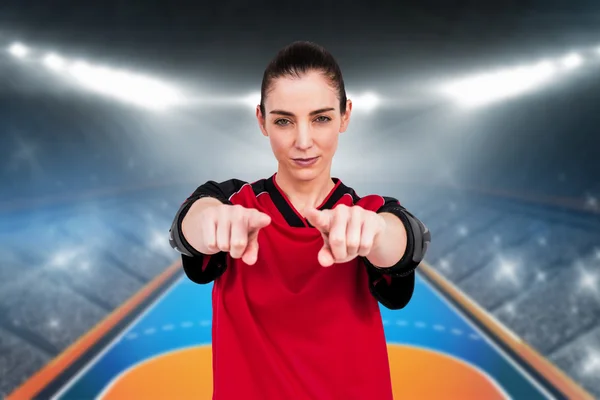 Athlete posing with elbow pads and pointing