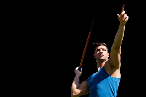 Sportsman practising javelin throw