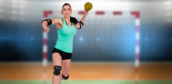 Athlete with elbow pads throwing handball